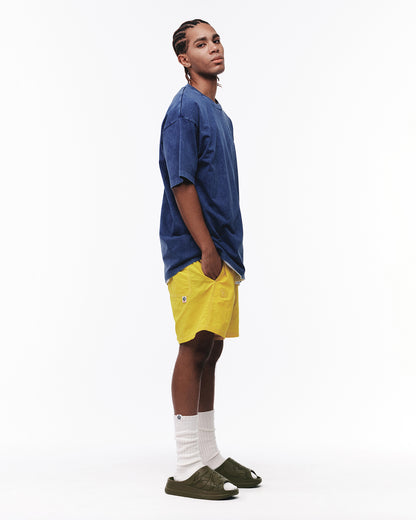 Shorts tejidos AAPENOW con logo moonface